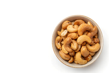 Fototapeta premium Bowl of Golden-Brown Roasted Cashews Positioned Right Side on White Background with Copy Space