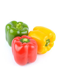 Three sweet Red, Yellow, Green Peppers isolated on white background.