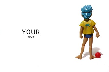 Boy doll and red color ball, holiday and sport concept, isolated on white background.