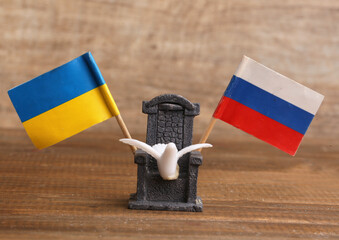 negotiating chair and peace dove between ukraine and russia