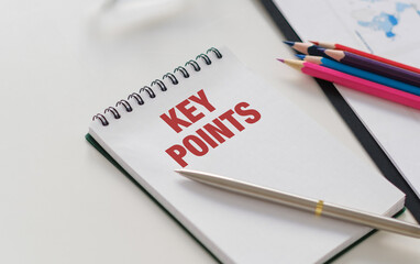 A notebook with the word Key Points written on it