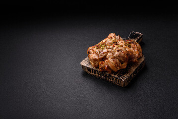 Grilled boneless chicken thigh with salt, spices and herbs