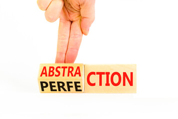 Perfection or abstraction symbol. Concept words Perfection Abstraction on beautiful wooden blocks. Beautiful white background. Businessman hand. Business perfection or abstraction concept. Copy space