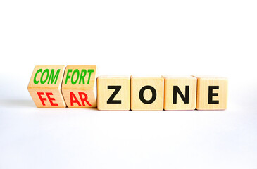 Fototapeta premium Comfort or fear zone symbol. Concept words Comfort zone Fear zone on wooden cubes. Beautiful white table white background. Business and comfort or fear zone concept. Copy space.