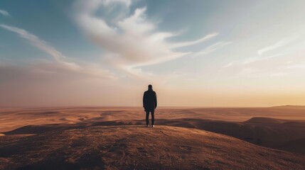 Captivating depiction of a solitary person standing atop a dune, gazing over a vast desert under a soft, dreamy sky. AI generated.