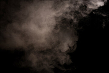 White steam on a black background.