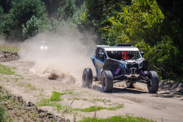 UTV buggy, 4x4 competition on dusty road. Rally, extreme, adrenalin