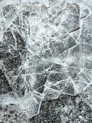 Ice crust on the pavement, paving stones, frozen water on a pavers