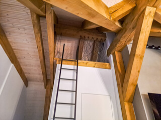 stairs in a new house to a sleeping town. modern style in a wooden house