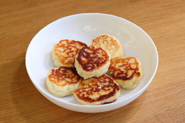 Enjoy these Delicious Homemade Cheese Pancakes beautifully served on a White Plate