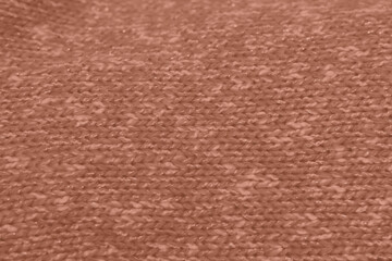 Fototapeta premium Mocha Mousse toned colour monochrome texture knitted fabric. Knitted Jersey as textile background. Monochrome color background. Wool knitting texture. Trendy color 2025.