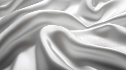 Obraz premium Close-up of smooth silk texture with gentle light reflecting off folds.