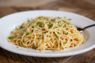 Carbonara pasta, spaghetti with pancetta, egg, hard Parmesan cheese and cream sauce. Traditional Italian cuisine. Pasta alla carbonara.