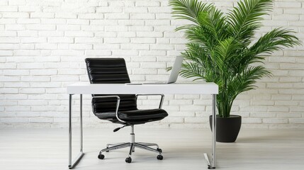 Modern home office with white desk, black leather chair, laptop, and palm plant against a brick wall.