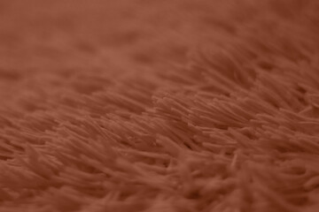 Mocha Mousse toned colour monochrome texture knitted fabric. Knitted Jersey as textile background. Monochrome color background. Wool knitting texture. Trendy color 2025.