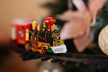 A Colorful and Vibrant Toy Train is Elegantly Displayed During the Festive Holiday Season