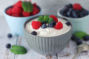 A bowl with Greek yogurt with berries