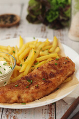 Fish and chips served on the plate, traditional dish of Great Britain