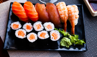Combined sushi - maki salmon, nigiri variado closeup. Japanese cuisine