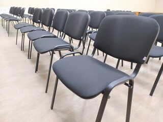 Empty chairs in a conference hall or seminar room, business and education concept