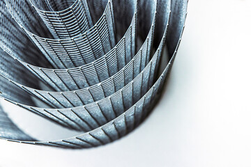 Abstract spiral metal coiled wire mesh with grid pattern, geometric symmetry, modern minimal design...