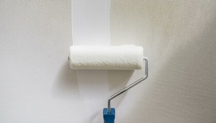 Obraz premium Roller applying paint to wall, scene of smooth rolling on wall