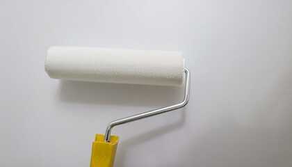 Obraz premium Roller applying paint to wall, scene of smooth rolling on wall