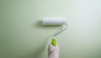 Fototapeta premium Roller applying paint to wall, scene of smooth rolling on wall