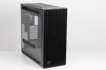 Side view of empty  big tower, PC case, chassis,  tempered-glass left panel has a mesh window to aid in graphics-card ventilation