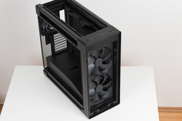 Big tower, empty PC case, chassis, photo of the top of the computer case, without upper and  front panel, without tempered-glass left panel,  one rear 140 mm and two 200mm front system fans