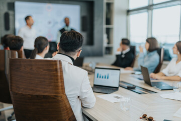 A multicultural group of business people engaged in a meeting, brainstorming solutions and sharing ideas in a modern office setting.