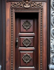 Traditional balinese handmade carved wooden door. Bali style furniture with ornament details. Old and vintage local style of architecture in Bali. Handmade details, minimalism, with white tones