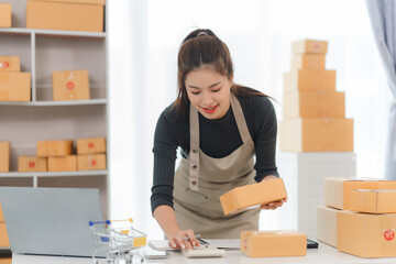 Happy Small Business Owner Packing Orders 