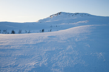 evening light over a beautiful winter landscape in norway