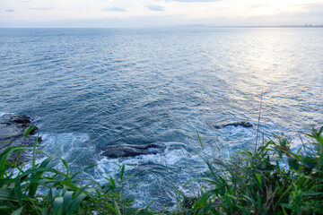 Serene Coastal View with Gentle Ocean Waves and Rocky Shoreline
