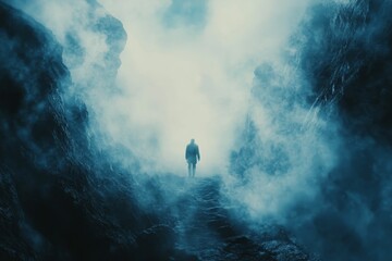 Fototapeta premium Solitary figure ascends misty, rocky chasm.