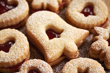 Traditonal Linzer Christmas cookies filled with marmalade and dusted with sugar