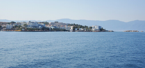 Fototapeta premium seashore with small houses of local residents. the endless blue sea in the rays of the sun. beauty in nature. travel and summer holiday destination