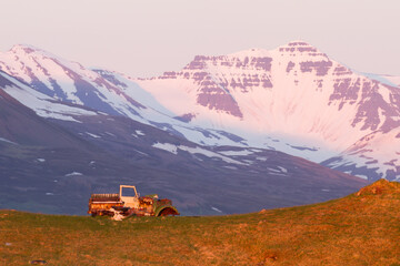 old rusted tractor in the evening in iceland