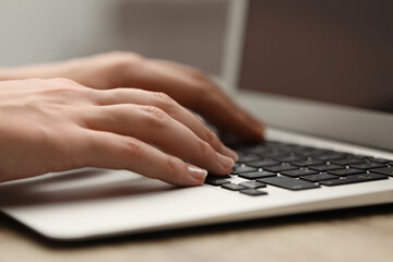 Businessman using laptop at table, closeup. Modern technology