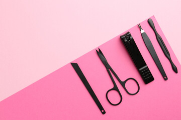 Set of pedicure tools on color background, flat lay. Space for text
