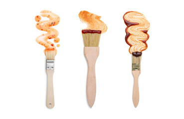 Basting brushes with marinade on white background, set