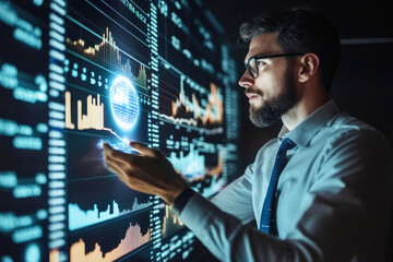 Caucasian male analyzing financial data on digital screen in modern office