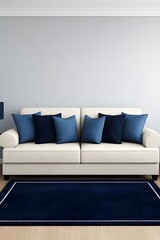 Stylish off-white sofa with navy blue pillows and rug in a minimalist living room.