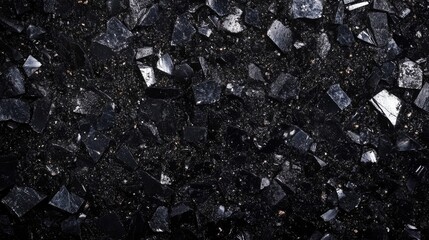 High-quality anthracite coal fines with a glossy black appearance and varying particle sizes for industrial applications and mineral analysis.