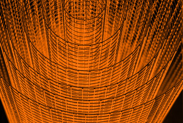 Abstract spiral with glowing red and orange tones and wire texture against a black background,...