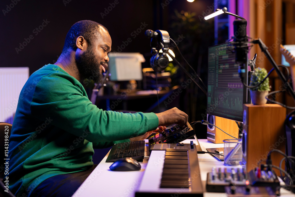 Aufkleber talented musician creating new soundtracks on mixing console, operating on audio equipment in home s