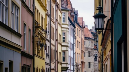 Fototapeta premium Charming European Street Scene: Pastel Buildings & Cobblestone Alleyway