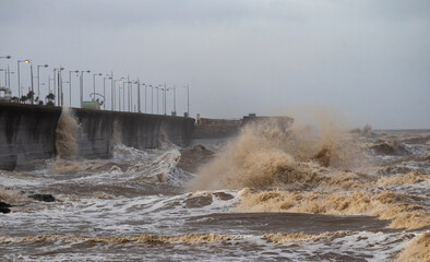 Heavy seas during storm striking coastal sea wall