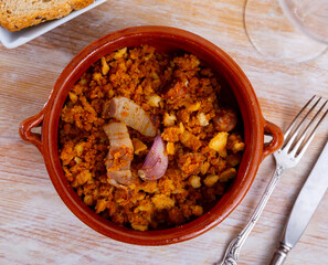 Spanish dish migas with bread crumbs served in bowl